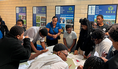 a Fulton employee mentoring students